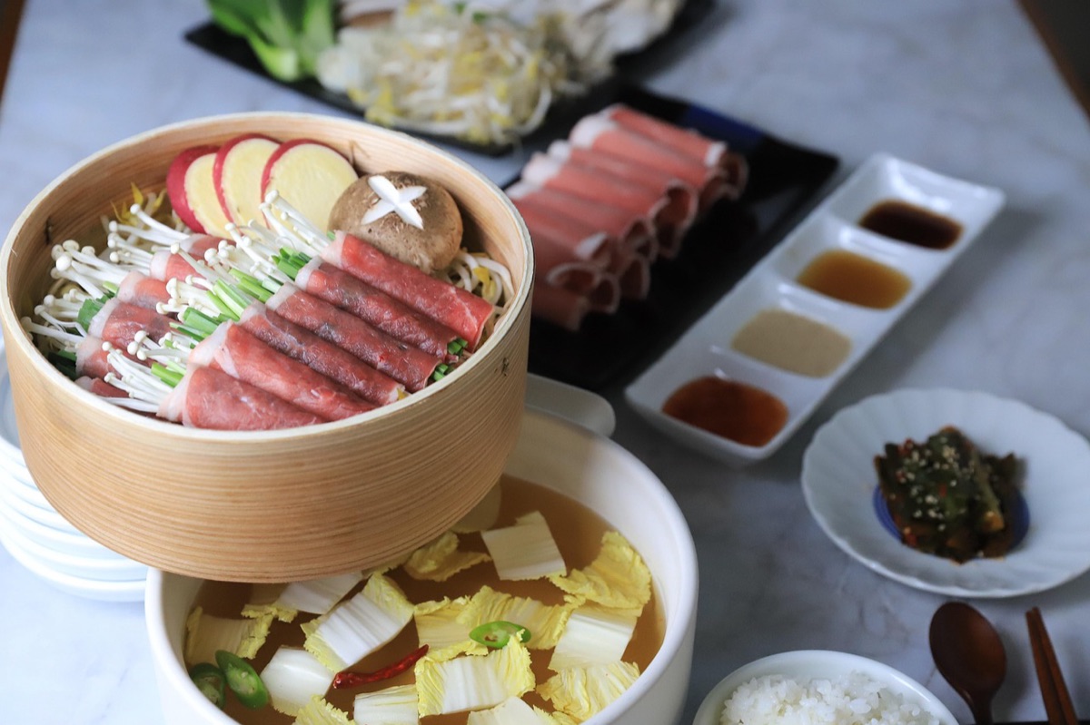 Korean rice cake with kimchi, traditional food preparation