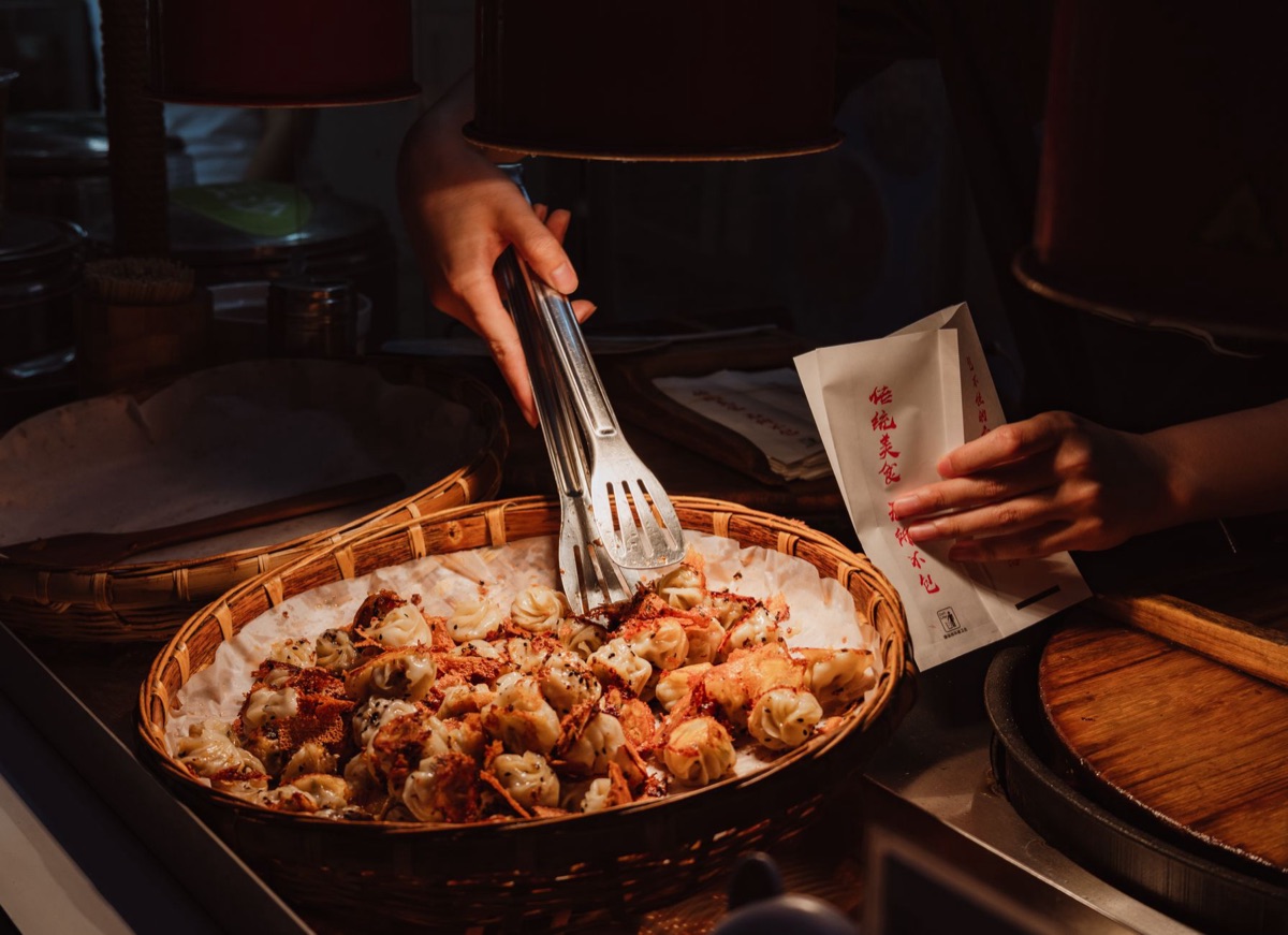 Street vendor selling Korean street snacks and dumplings